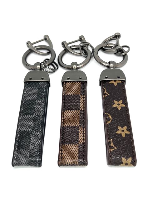 louis vuitton luggage keyrings.